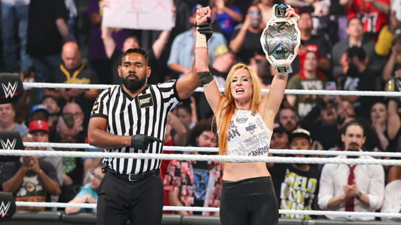 Becky Lynch with the "NXT" Women's title