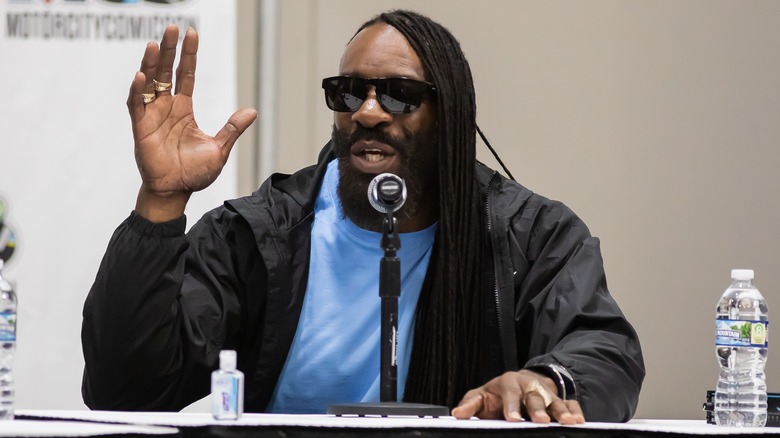 Booker T speaking and gesticulating