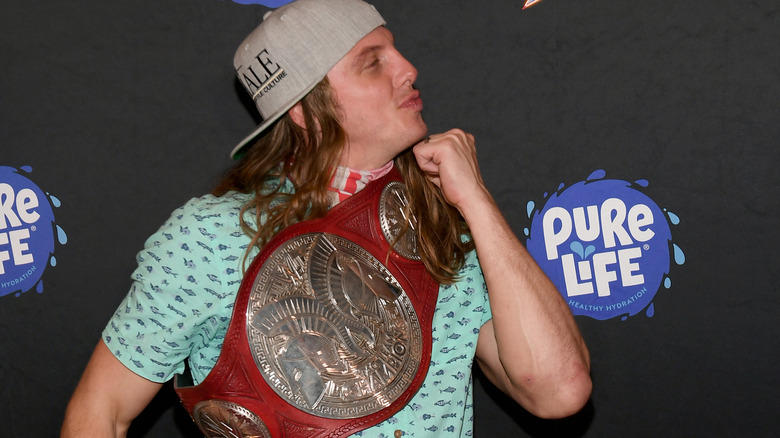 Matt Riddle poses with Raw Tag Team Title