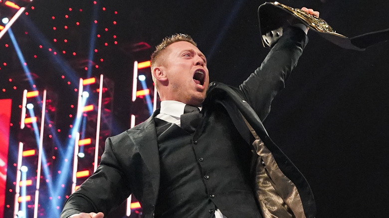 The Miz holding the WWE Intercontinental Championship
