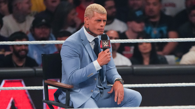 Cody Rhodes sits in a chair