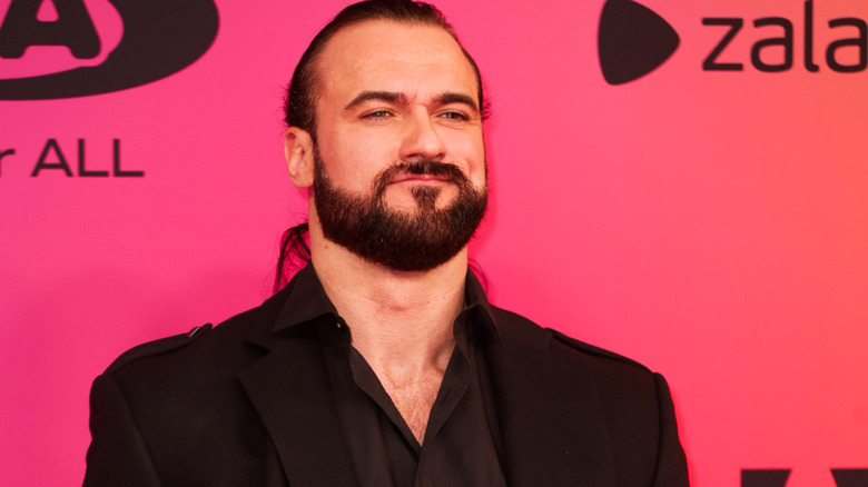 Drew McIntyre wearing a black suit