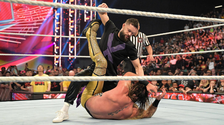 Finn Balor attacks Seth Rollins
