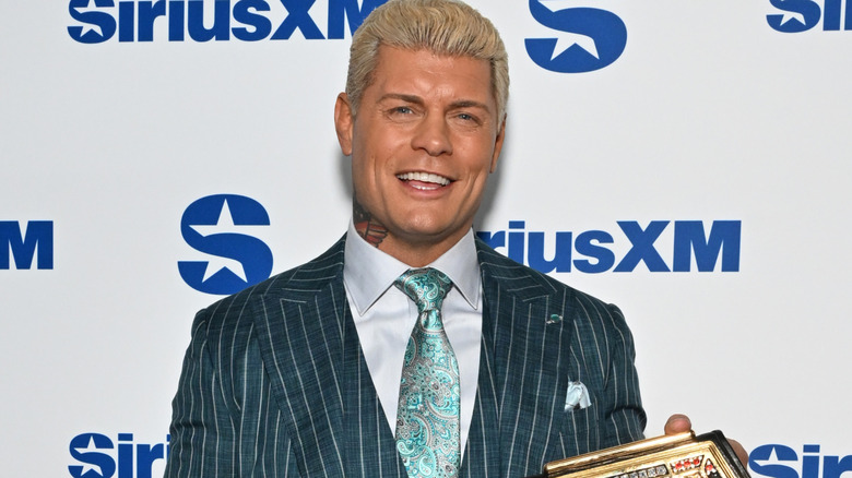 Cody Rhodes wearing a suit