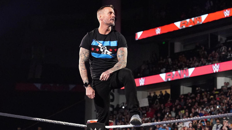 CM Punk standing on turnbuckle