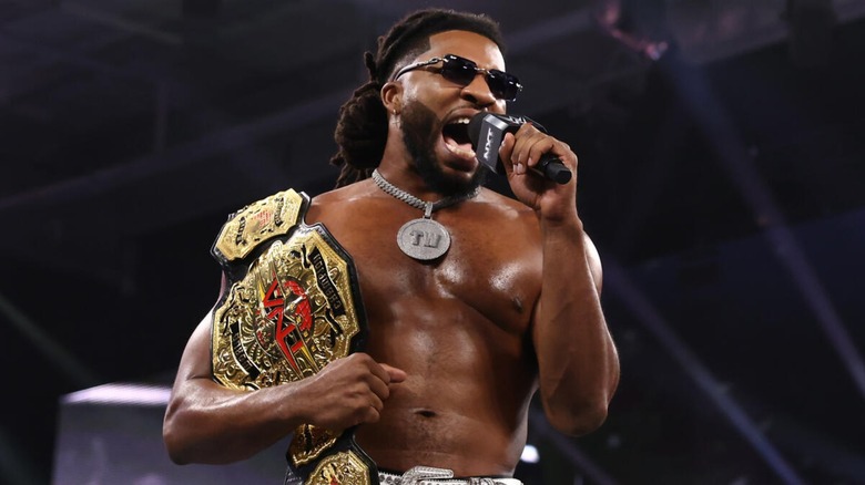 Trick Williams cutting a promo with the TNA World Championship on 