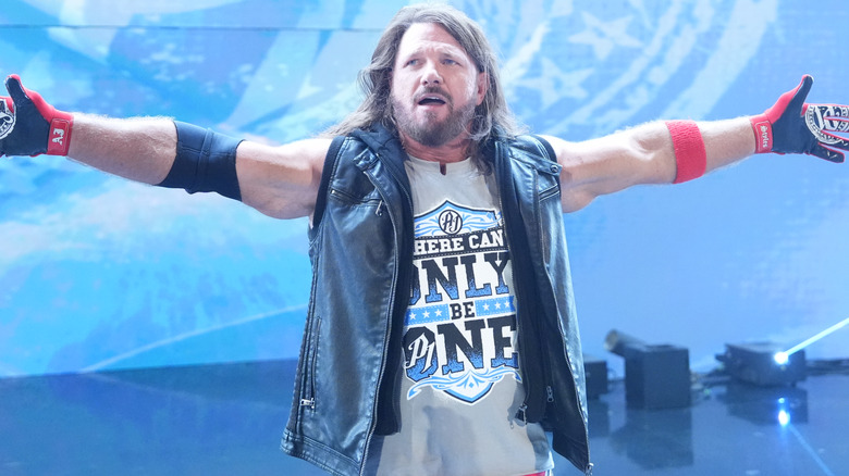 AJ Styles outstretching his arms.