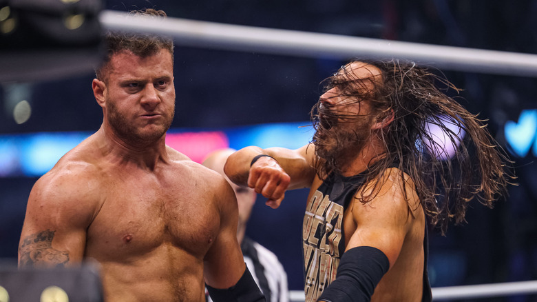 Adam Cole punching MJF