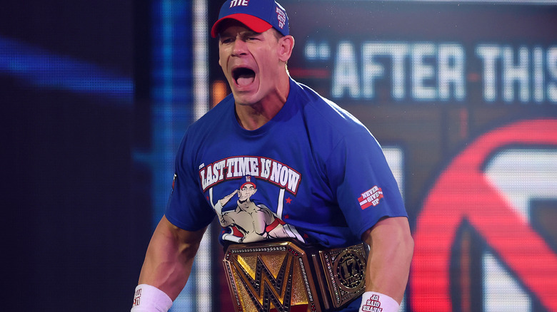 John Cena shouts as he makes his entrance as the Undisputed WWE Champion.