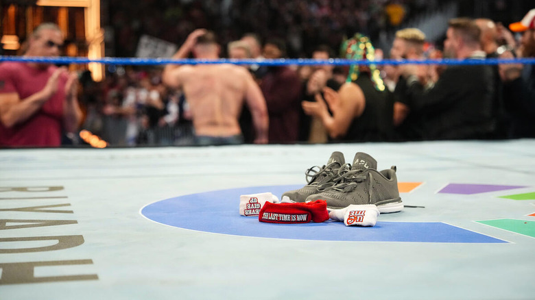 John Cena's headbands, wristbands, and sneakers are left in the ring as he leaves.