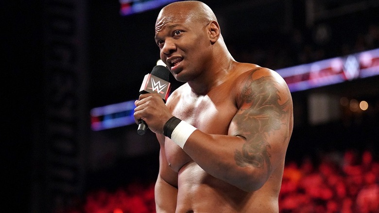 Shelton Benjamin holding a mic