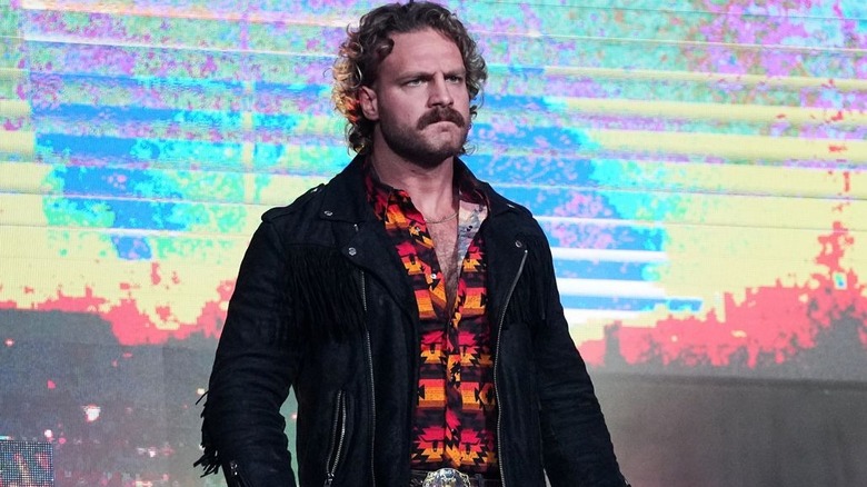 Adam Page wearing a black jacket