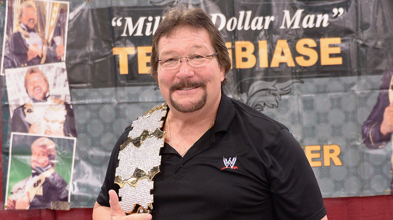 Ted Dibiase smiling with Million Dollar Belt