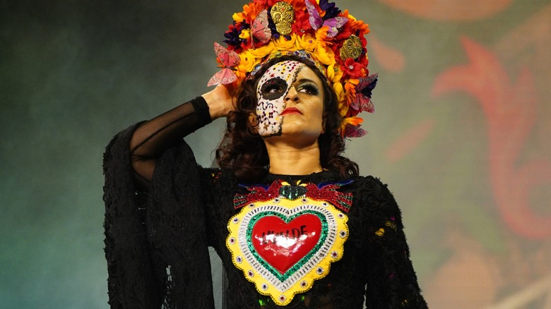 Thunder Rosa wearing headdress