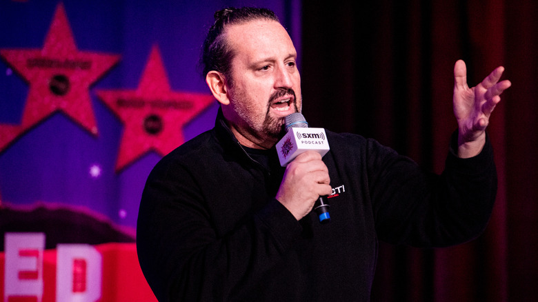 Tommy Dreamer talking into microphone