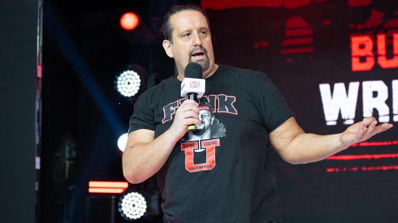 Tommy Dreamer speaking and shrugging