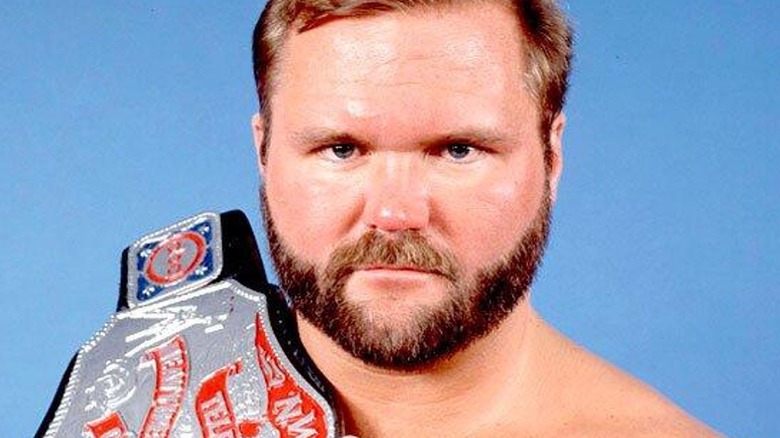 Arn Anderson posing with the NWA Television Championship during his reign with the belt.