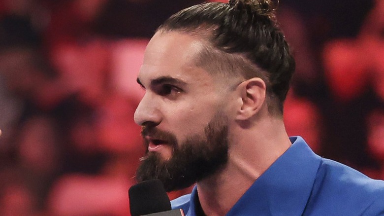 Seth Rollins speaks on the microphone