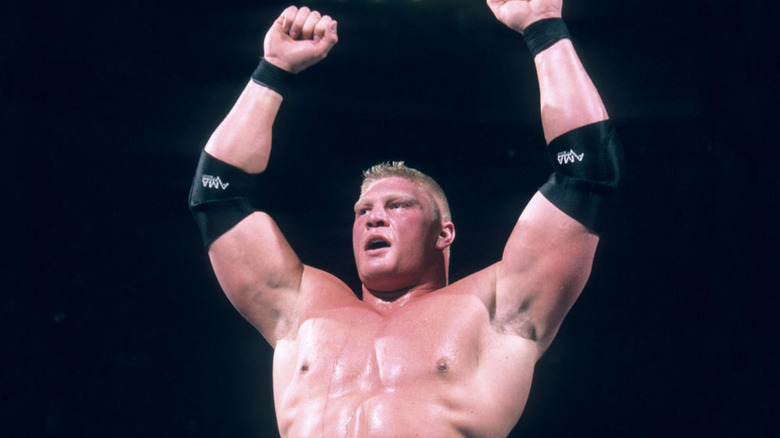 Brock Lesnar holding his arms up