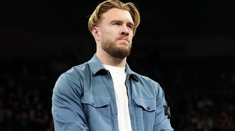 Will Ospreay wearing a blue jacket