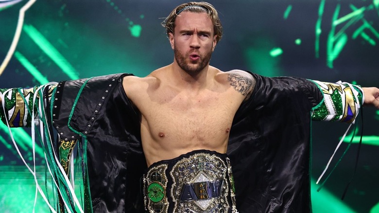 Will Ospreay wearing the AEW World Championship around his waist