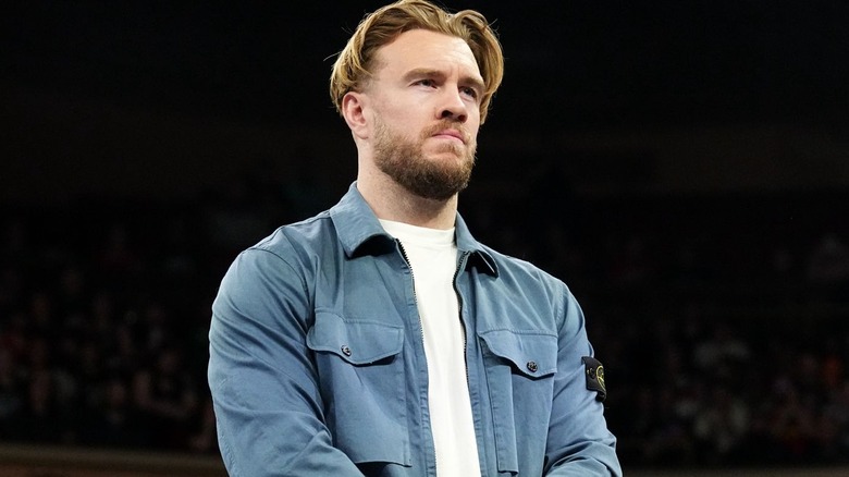Will Ospreay wearing a blue shirt