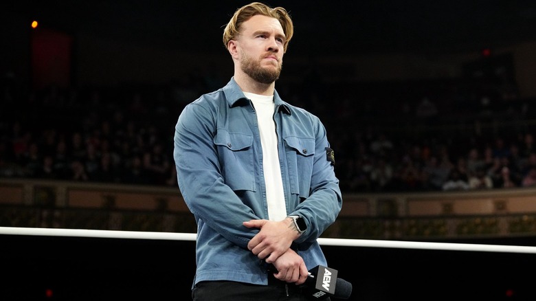 Will Ospreay stands in the ring