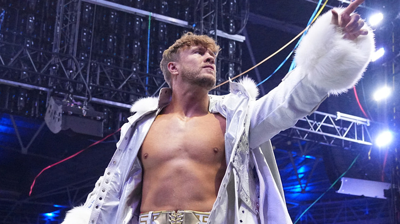 Will Ospreay wearing a white ring jacket