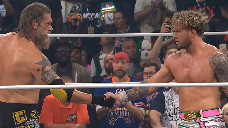 Will Ospreay and Adam Copeland shake hands