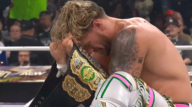 Will Ospreay celebrates with the AEW World Championship