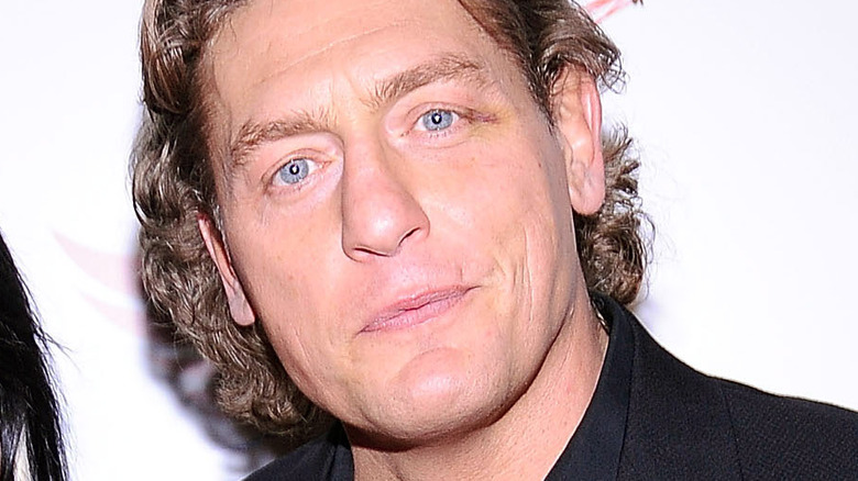 William Regal staring