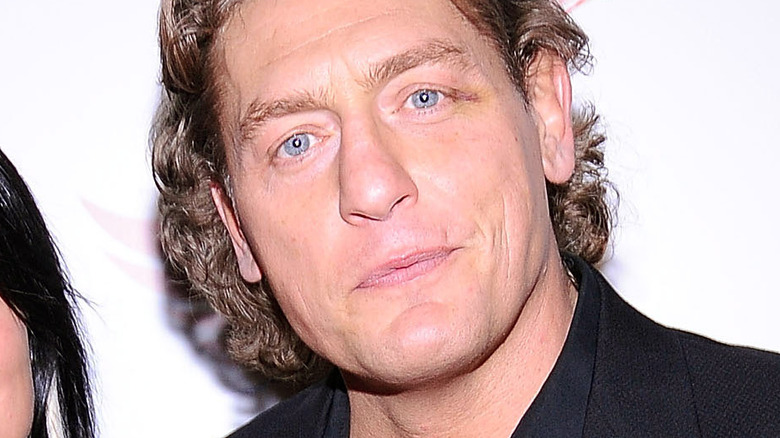 William Regal looking at a camera