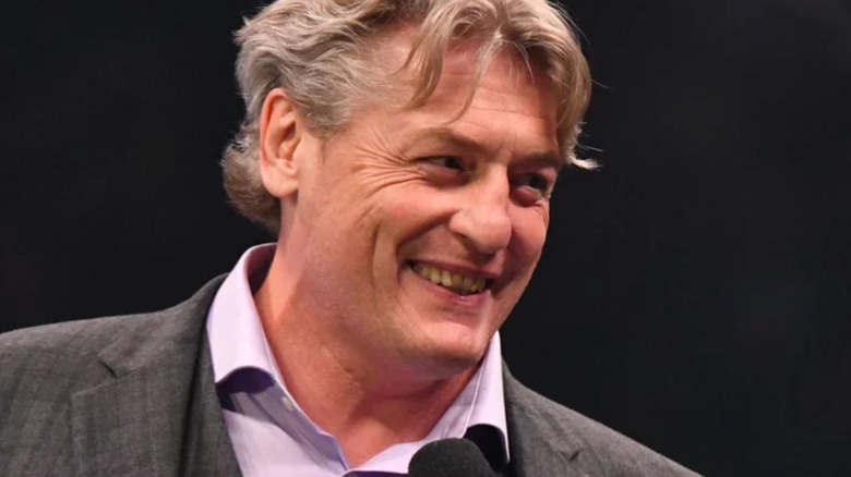 William Regal smiling microphone