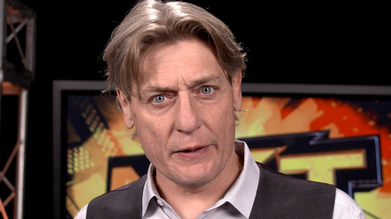 William Regal staring