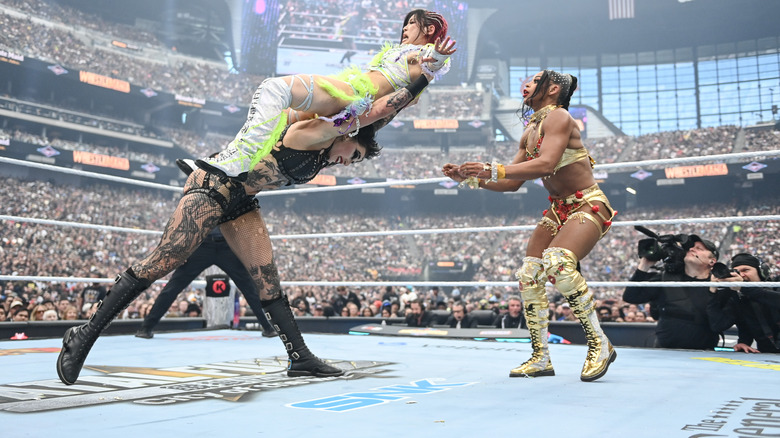 Rhea Ripley prepares to Razor's Edge IYO SKY into Bianca Belair at WWE WrestleMania 41