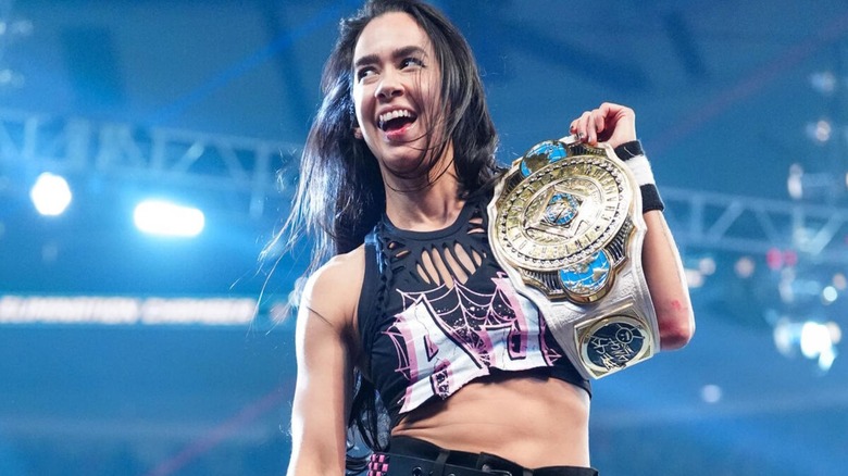 AJ Lee poses with her newly won Women's Intercontinental Championship after her victory over Becky Lynch at the 2026 Elimination Chamber.