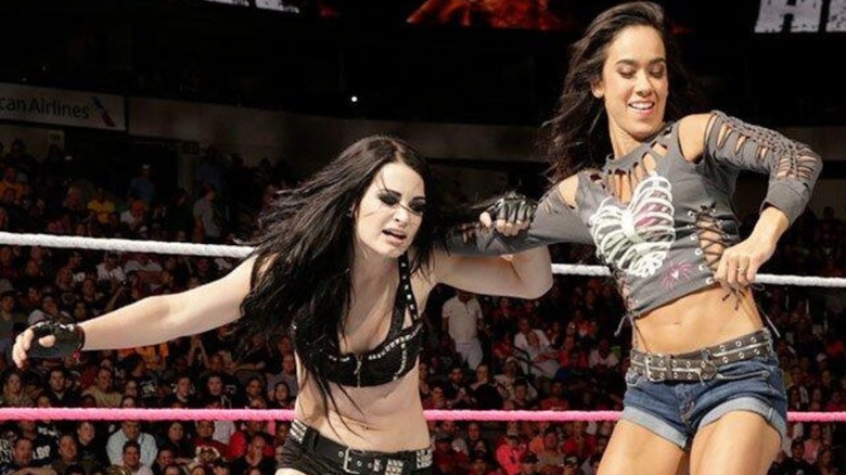AJ Lee moves to whip Paige into the ropes during their Divas Championship match at Hell in a Cell 2014.