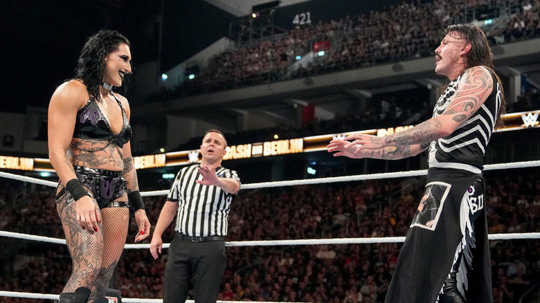 Rhea Ripley is smiling at Dominik Mysterio