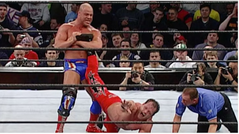 Kurt Angle with an ankle lock on Chris Benoit at Royal Rumble 2003