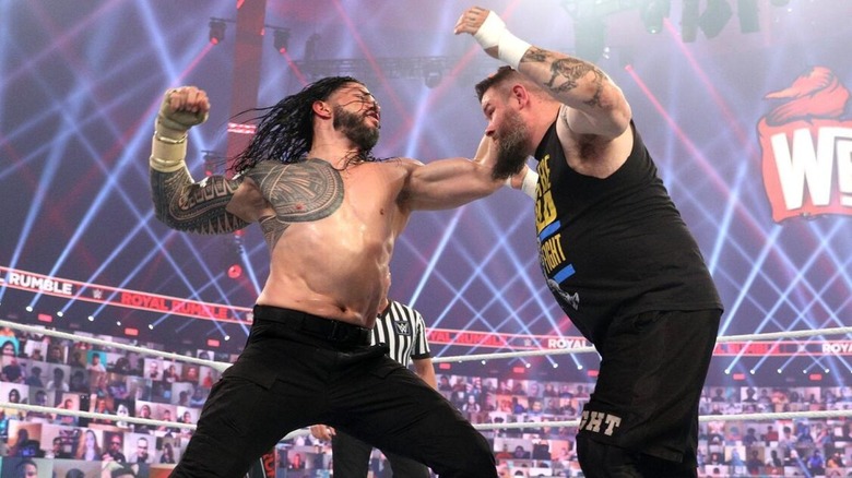 Roman Reigns and Kevin Owens fight