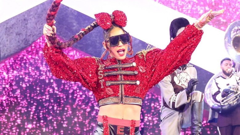 Bianca Belair heads down the ramp, flanked by a marching band playing her down to the ring, for a WrestleMania match.