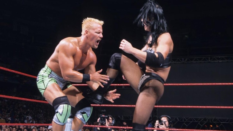 Chyna delivers a kick to Jeff Jarrett during their Good Housekeeping match at No Mercy 1999.