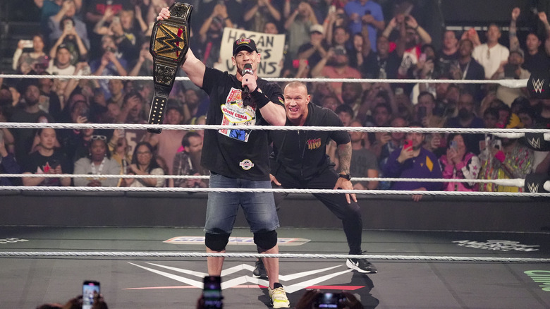 Randy Orton prepares to RKO a clueless John Cena holding up the WWE title on "Raw"