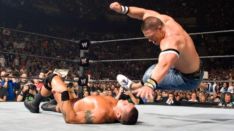 John Cena about to hit Randy Orton in the face