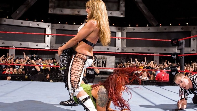 Trish Stratus puts Lita in the Walls of Jericho in the middle of the ring during their match at Unforgiven 2006.