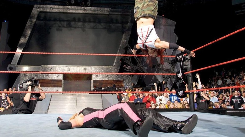 Lita hits a moonsault on Trish Stratus during their main event match for the WWE Women's Championship during a December 2004 episode of "WWE Raw."