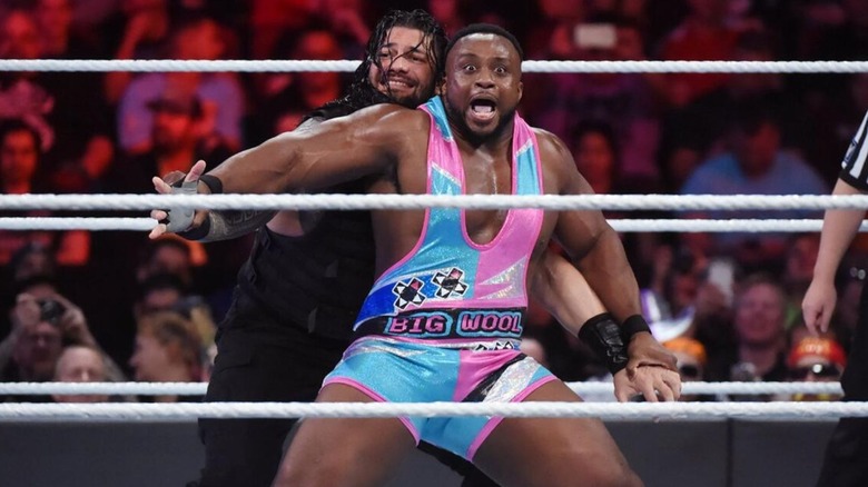 Big E powers out of a hold by Roman Reigns in the ring during The New Day's match against the Shield at Survivor Series 2017.