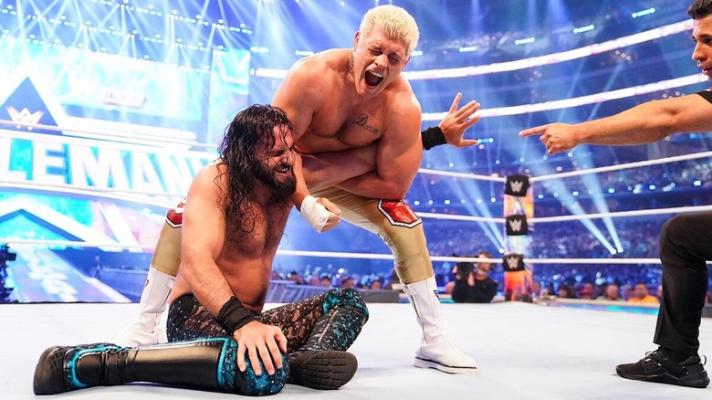 Cody Rhodes with an arm bar on Seth Rollins at WWE WrestleMania 38