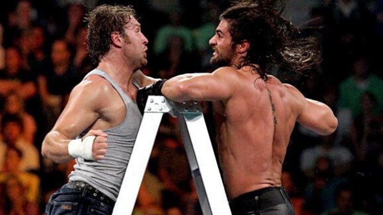 Dean Ambrose and Seth Rollins fight atop a ladder