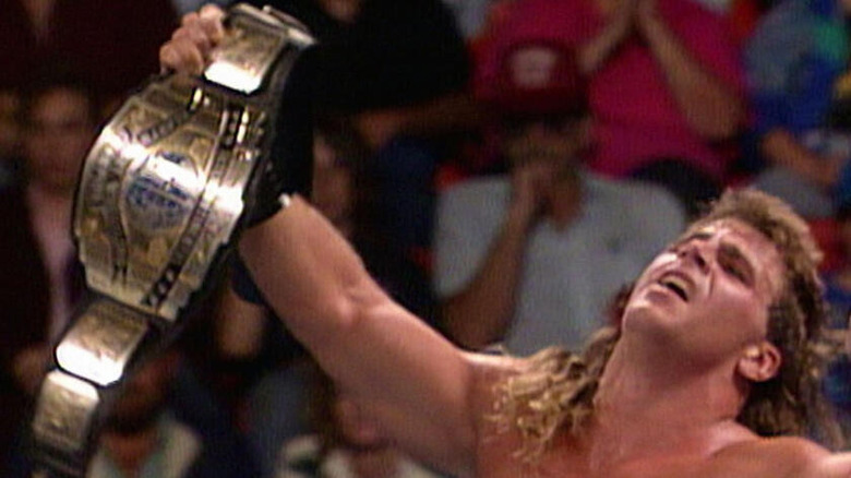 Shawn Michaels holds up the Intercontinental Championship